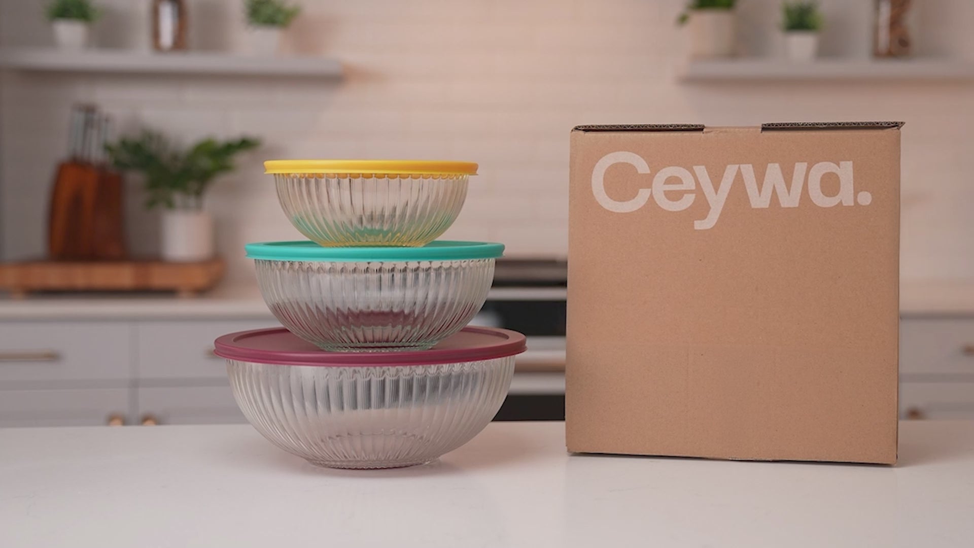 Load video: Ceywa glass mixing bowls demo video showing the use of salad bowls and stackable design and airtight lids