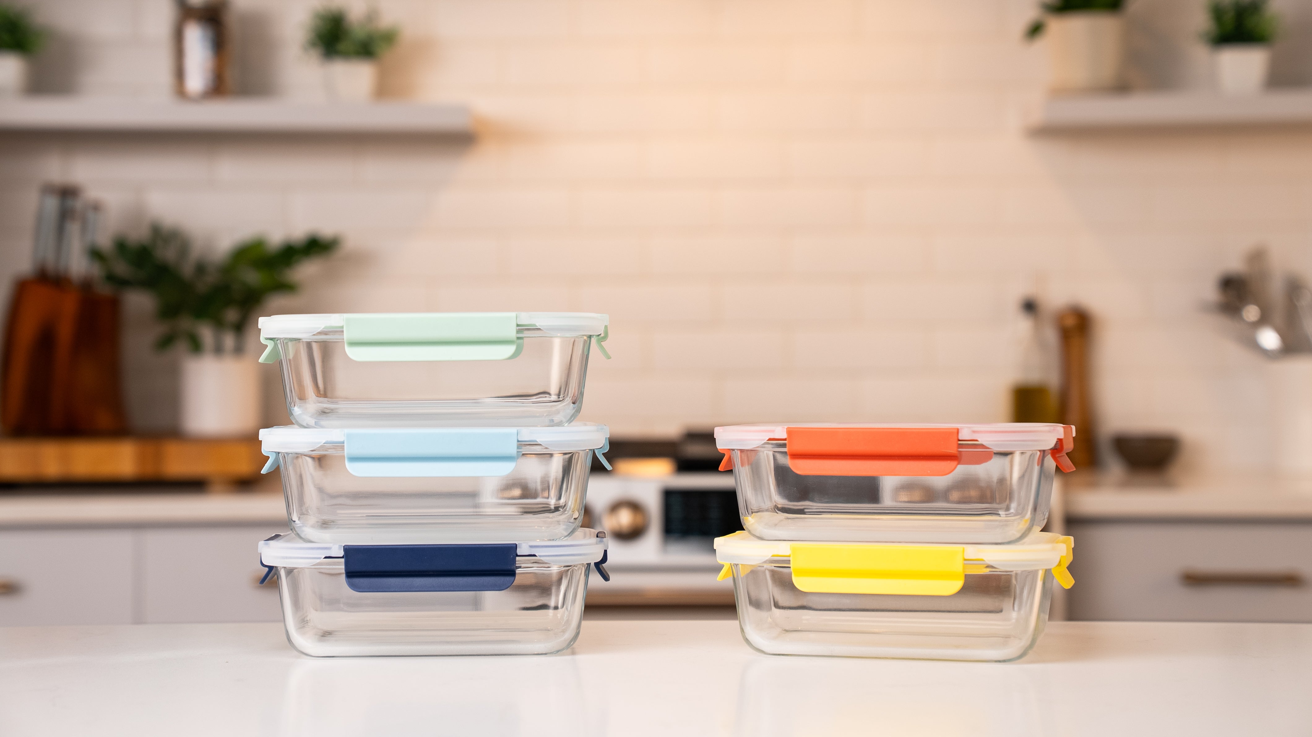 Ceywa 5-piece glass food storage container set with colorful airtight lids on kitchen countertop